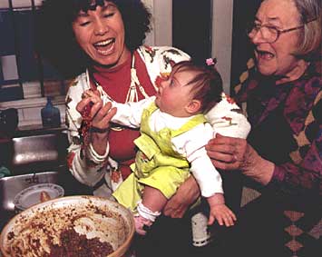 Me trying to stir the Christmas pudding which went up in the air! 18kb