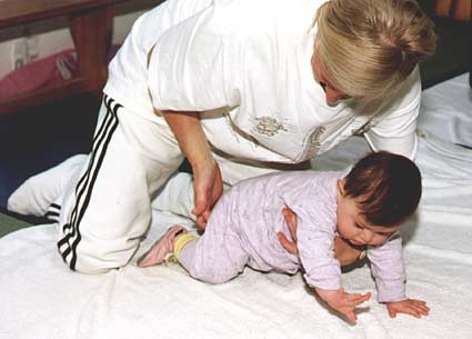My physio trying to get me to crawl, which I haven't quite got the hand of yet. 22kb